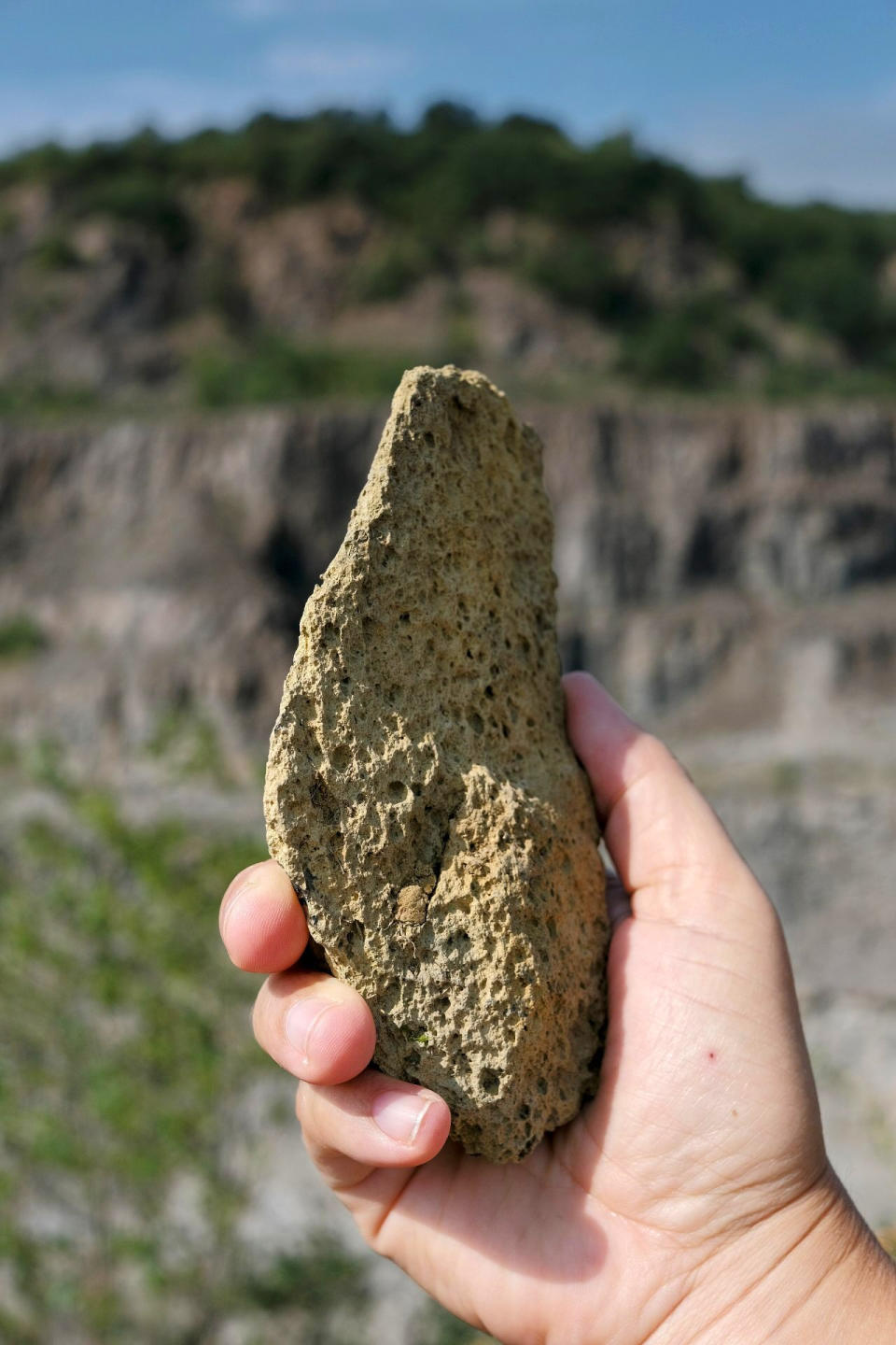 This photo provided by researcher Roman Garba shows a heavily weathered flake artifact at the Korolevo I archaeological site in western Ukraine in August 2023. Stone tools found in the area are the earliest evidence of early human presence in Europe, dating back to 1.4 million years ago, according to research published in the journal Nature on Wednesday, March 6, 2024. (Roman Garba via AP)