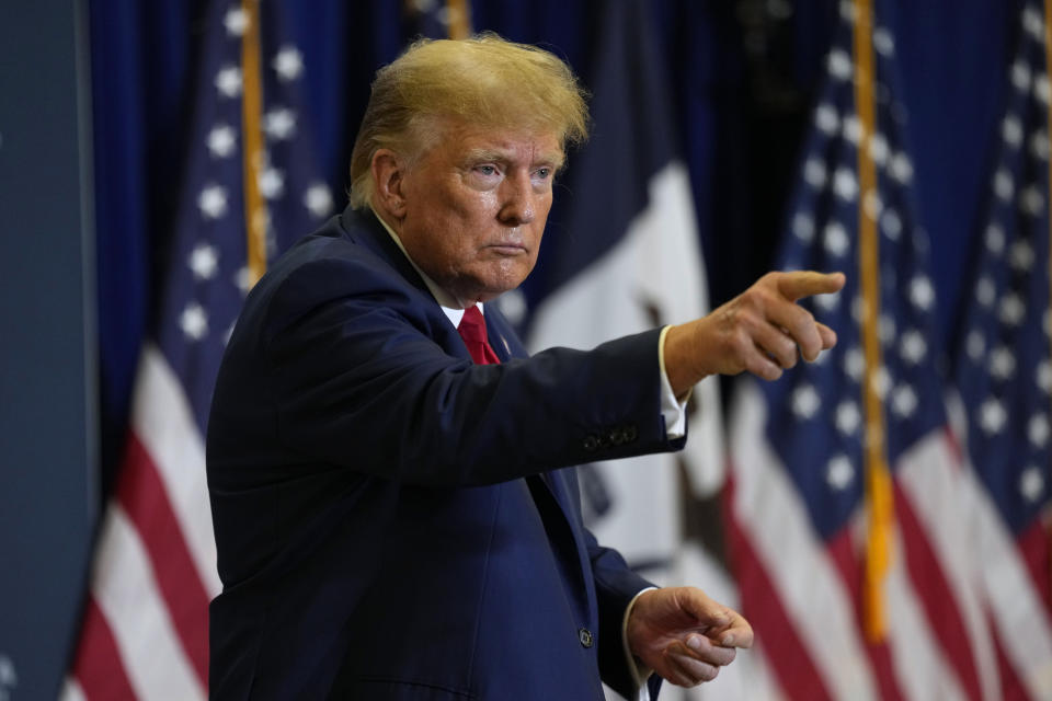 Former President Donald Trump leaves the stage during a commit to caucus rally, Friday, Jan. 5, 2024, in Mason City, Iowa. (AP Photo/Charlie Neibergall)