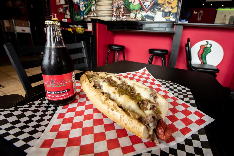 Johnny's Dirty Dog, available at Johnny Longhots in Fairless Hills, comes with two fried hot dogs topped with chopped fresh ribeye, green peppers, onions and melted Cooper sharp cheese on a Liscio's seeded Italian roll.