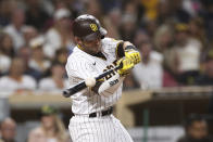 San Diego Padres' Austin Nola hits an RBI single against the Philadelphia Phillies during the sixth inning of a baseball game Friday, June 24, 2022, in San Diego. (AP Photo/Derrick Tuskan)