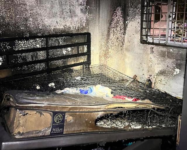 Fire in a bedroom of the unit at Block 218, Marsiling Crescent on 22 June 2022. (PHOTO: Singapore Civil Defence Force)