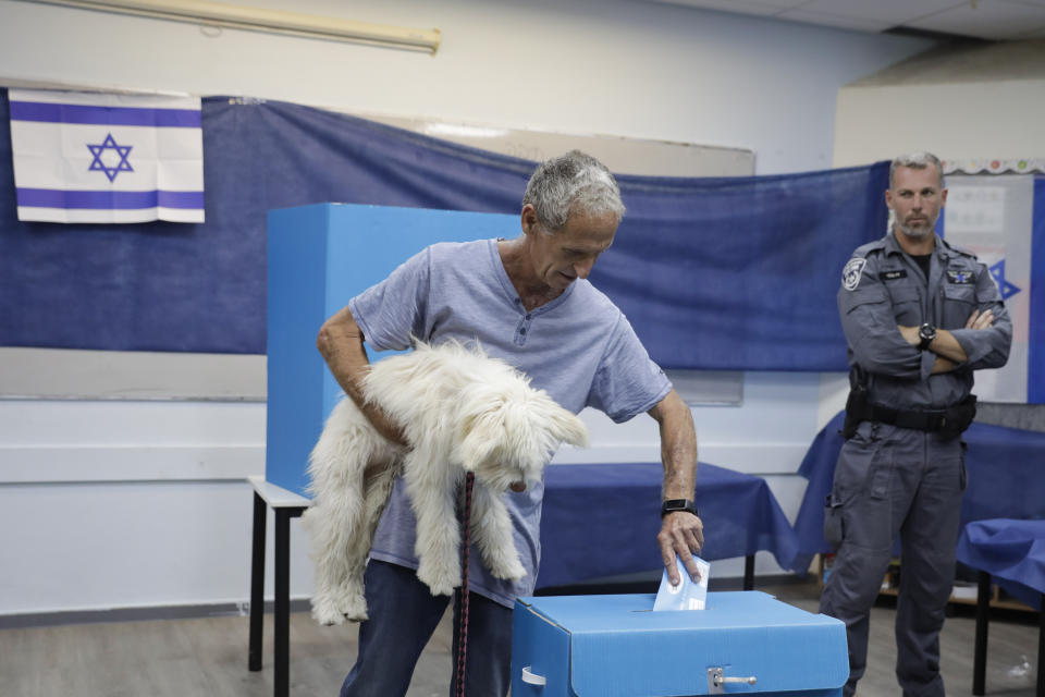 A man votes at a polling station in Rosh Haayin, Israel, Tuesday, Sept. 17, 2019. Israelis began voting Tuesday in an unprecedented repeat election that will decide whether longtime Prime Minister Benjamin Netanyahu stays in power despite a looming indictment on corruption charges. (AP Photo/Sebastian Scheiner)