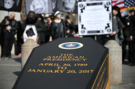 <p>A coffin is propped up under the arch during the “Mock Funeral for Presidents’ Day” rally at Washington Square Park in New York City on Feb. 18, 2017. (Gordon Donovan/Yahoo News) </p>