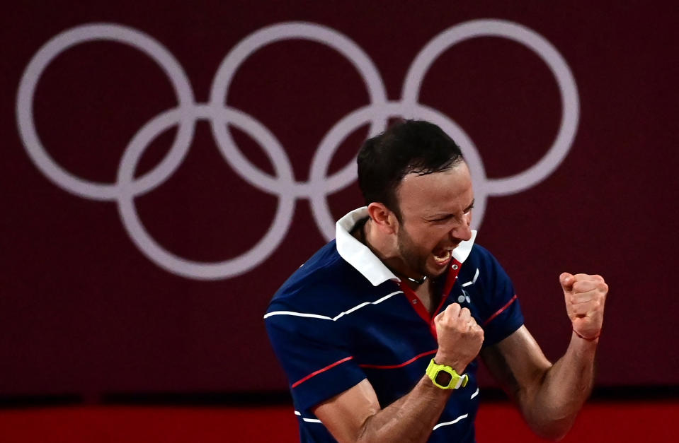 <p>Guatemala's Kevin Cordon (R) celebrates his win over Netherlands' Mark Caljouw in their men's singles badminton round of 16 match during the Tokyo 2020 Olympic Games at the Musashino Forest Sports Plaza in Tokyo on July 29, 2021. (Photo by Pedro PARDO / AFP) (Photo by PEDRO PARDO/AFP via Getty Images)</p> 