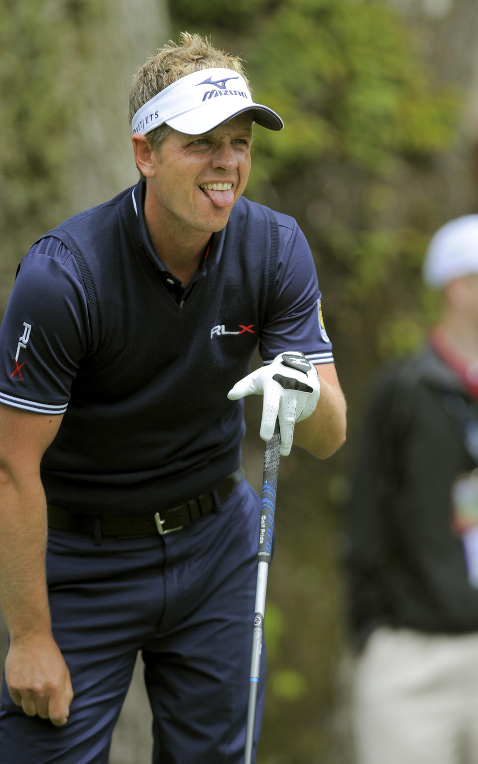 Luke Donald, of England, reacts after his drive off the third tee during the final round of the RBC Heritage golf tournament in Hilton Head Island, S.C., Sunday, April 20, 2014. (AP Photo/Stephen B. Morton)