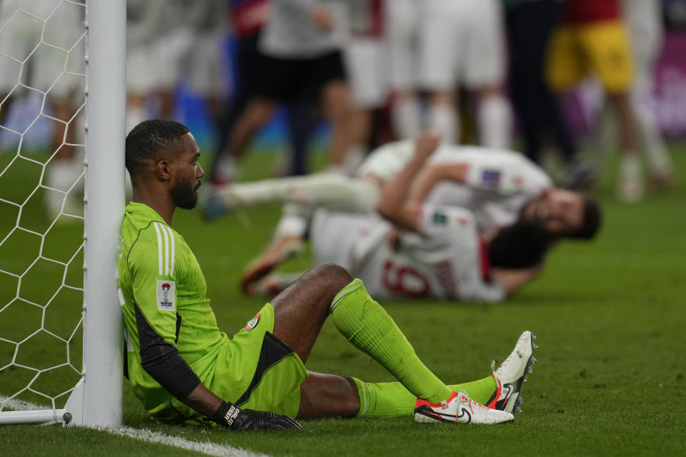 United Arab Emirates' goalkeeper Khalid Eisa Almesmari, rests against the goal post after his team lost during the Asian Cup round of 16 soccer match between Tajikistan and United Arab Emirates at Ahmad Bin Ali Stadium in Doha, Qatar, Sunday, Jan. 28, 2024. (AP Photo/Aijaz Rahi)