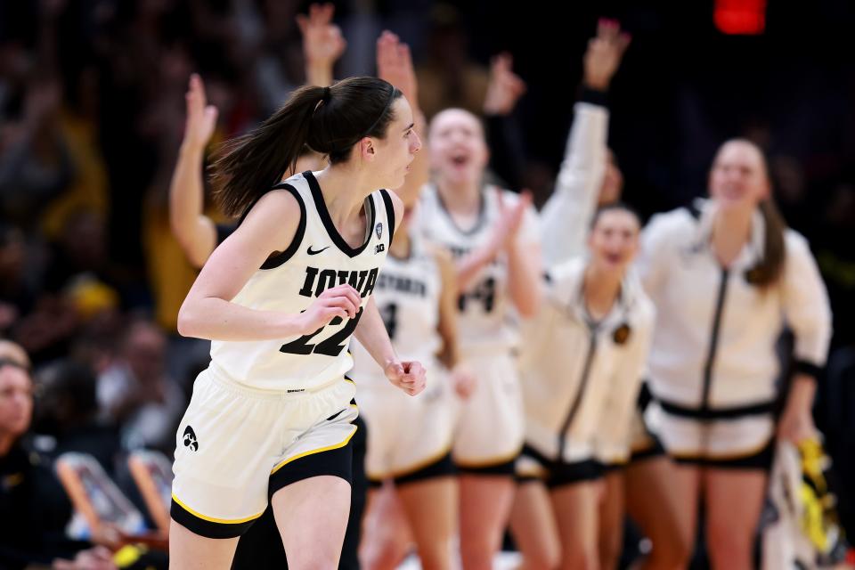 CLEVELAND, OHIO - APRIL 05: Caitlin Clark #22 of the Iowa Hawkeyes reacts after a three point basket in the second half during the NCAA Women's Basketball Tournament Final Four semifinal game against the UConn Huskies at Rocket Mortgage Fieldhouse on April 05, 2024 in Cleveland, Ohio. (Photo by Gregory Shamus/Getty Images)