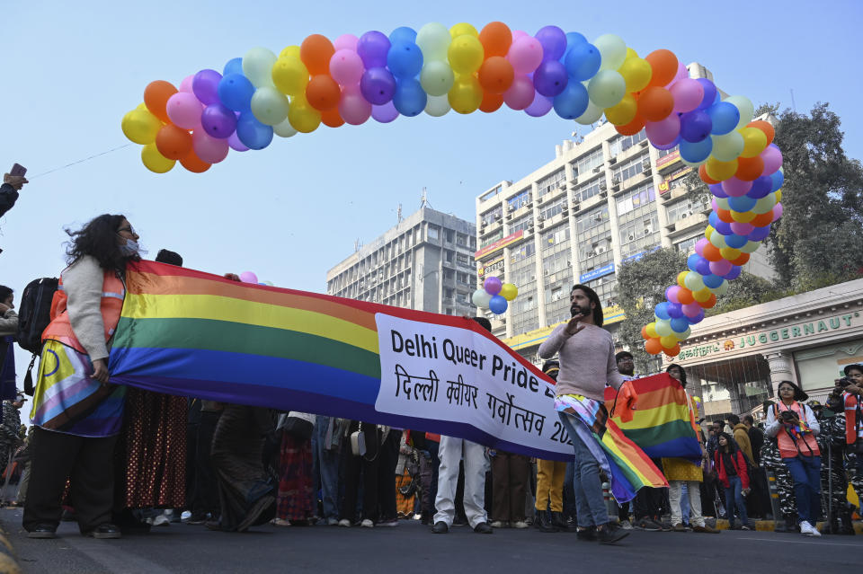 Members of the LGBTQ community and their supporters carry a rainbow flag as they march demanding equal marriage rights in New Delhi, India, Sunday, Jan.8 2023. The government is yet to legalize same-sex marriages in the country even though the Supreme Court in 2018 struck down a colonial-era law that made gay sex punishable by up to 10 years in prison. (AP Photo)