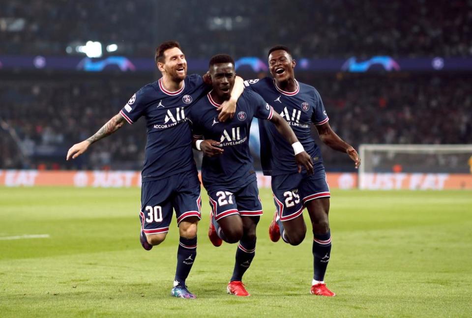 Idrissa Gueye (centre) celebrates his early goal with Lionel Messi and Nuno Mendes.