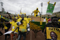 Supporters of Kenyan presidential candidate William Ruto celebrate at his final electoral campaign rally at Nyayo stadium in Nairobi, Kenya Saturday, Aug. 6, 2022. Kenya is due to hold its general election on Tuesday, Aug. 9 as the East Africa's economic hub chooses a successor to President Uhuru Kenyatta. (AP Photo/Ben Curtis)