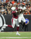 Arizona Cardinals tight end Deon Yelder, left, and Cincinnati Bengals safety Dax Hill both fail to come down with a pass during the second quarter of an NFL football preseason game in Cincinnati, Friday, Aug. 12, 2022. (AP Photo/Jeff Dean)