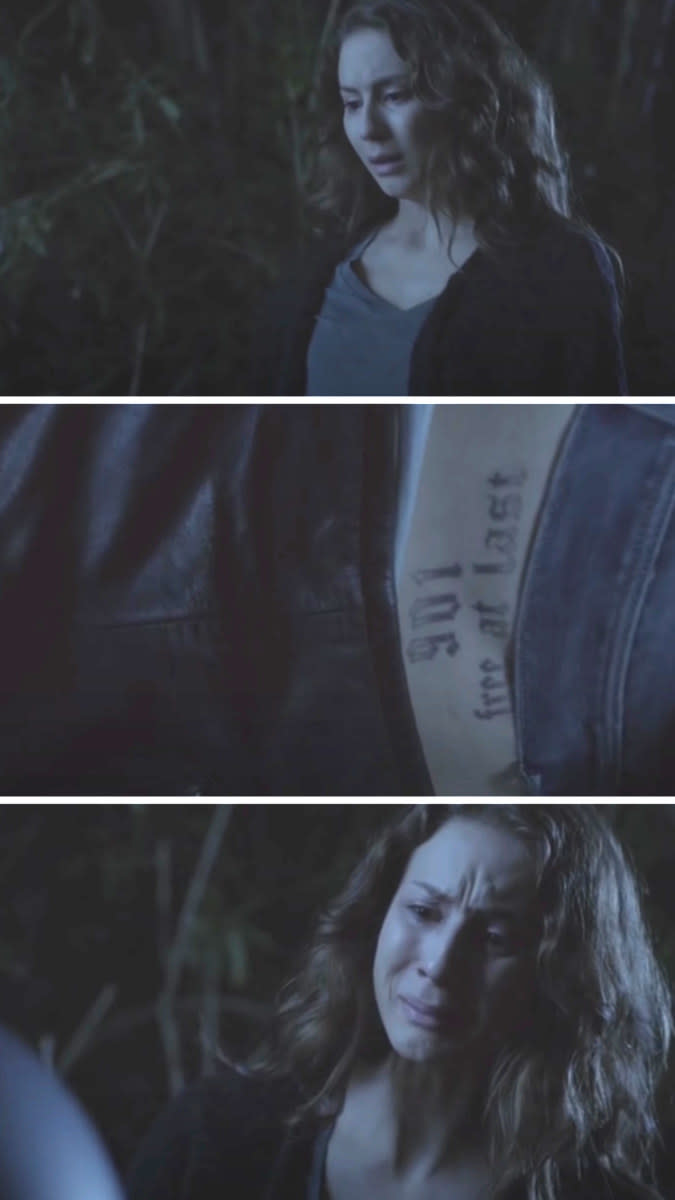 Spencer sees Toby's tattoo on the body on the ground and cries