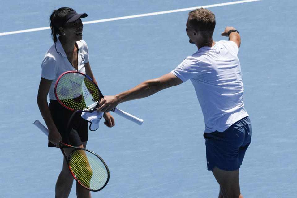 Hsieh Su-Wei, left, of Taiwan and Jan Zielinski of Poland celebrate after defeating Desirae Krawczyk of the U.S. and Neal Skupski of Britain in the mixed doubles final match at the Australian Open tennis championships at Melbourne Park, Melbourne, Australia, Friday, Jan. 26, 2024. (AP Photo/Alessandra Tarantino)