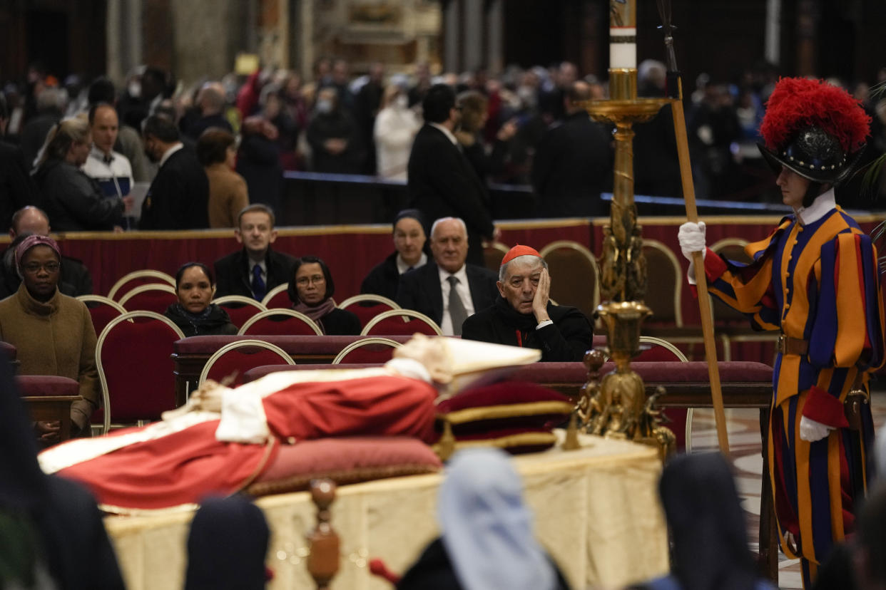 The body of late Pope Emeritus Benedict XVI is lied out in state inside St. Peter's Basilica at The Vatican, Wednesday, Jan. 4, 2023. Pope Benedict, the German theologian who will be remembered as the first pope in 600 years to resign, has died, the Vatican announced Saturday, Dec. 31, 2022. He was 95.(AP Photo/Ben Curtis)