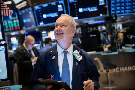 Traders work on the floor at the New York Stock Exchange (NYSE) in New York, U.S., May 16, 2019. REUTERS/Brendan McDermid