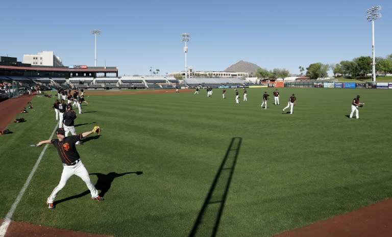 The San Francisco Giants payers warm up ahead of a training game against the Cleveland Indians, at Scottsdale Stadium in Arizona, on March 10, 2017