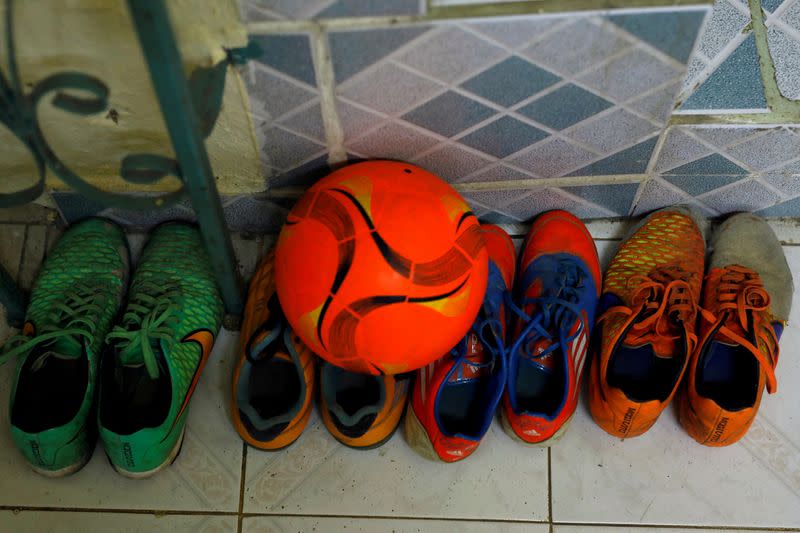 FILE PHOTO: Ball and soccer shoes belonging to Wild Boars captain Duangpetch Promthep seen in Chiang Rai