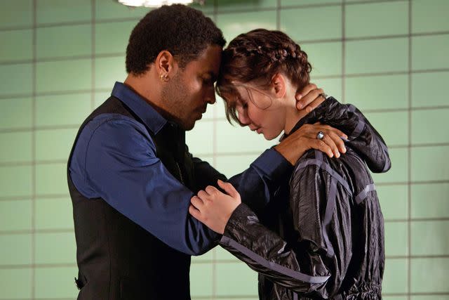 <p>Murray Close/Lionsgate/ Everett</p> Jennifer Lawrence and Lenny Kravitz in 'The Hunger Games'