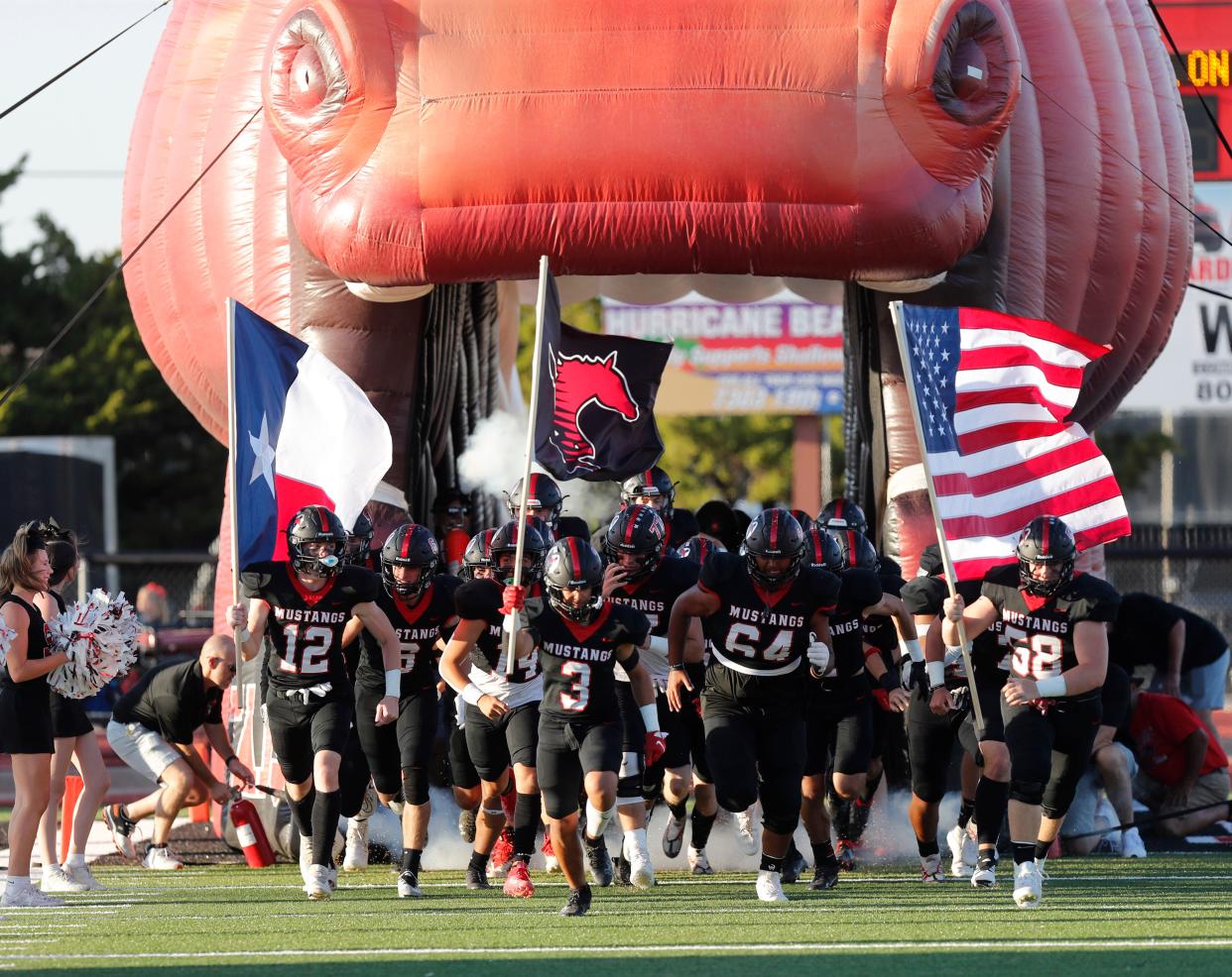 Shallowater runs onto the field before the game against Idalou, Friday, Sept. 23, 2022, at Todd Field in Shallowater.