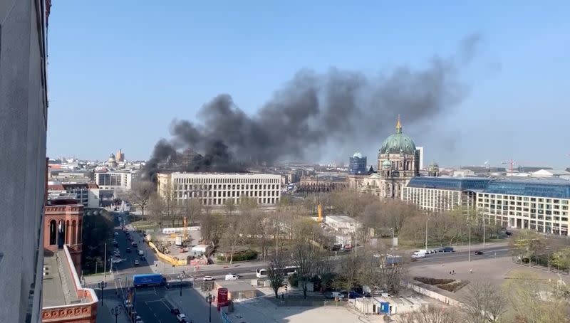 Smoke rises over the Berlin Palace (Stadtschloss) in Berlin