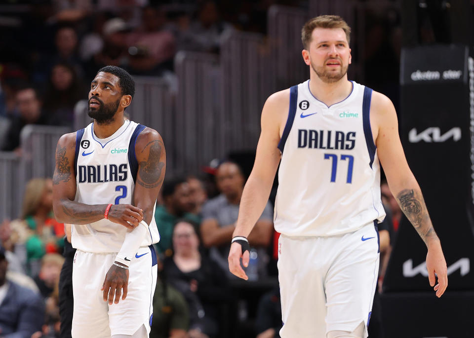 ATLANTA, GEORGIA - APRIL 02:  Kyrie Irving #2 and Luka Doncic #77 of the Dallas Mavericks react against the Atlanta Hawks during the fourth quarter at State Farm Arena on April 02, 2023 in Atlanta, Georgia.  NOTE TO USER: User expressly acknowledges and agrees that, by downloading and or using this photograph, User is consenting to the terms and conditions of the Getty Images License Agreement.  (Photo by Kevin C. Cox/Getty Images)