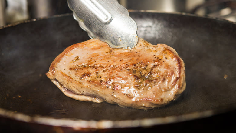 duck breast being seared