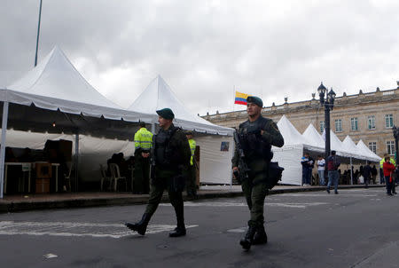 Police patrol a polling station during a seven-question referendum on anti-corruption measures in Bogota, Colombia August 26, 2018. REUTERS/Luisa Gonzalez