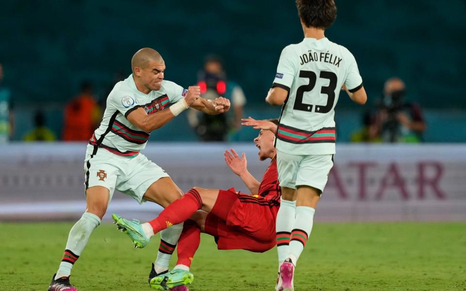 Pepe with fists up as Hazard falls to the ground - SHUTTERSTOCK