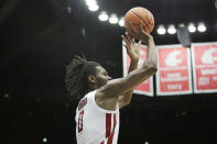 Washington State forward Efe Abogidi shoots during the first half of an NCAA college basketball game against Southern California, Saturday, Dec. 4, 2021, in Pullman, Wash. (AP Photo/Young Kwak)