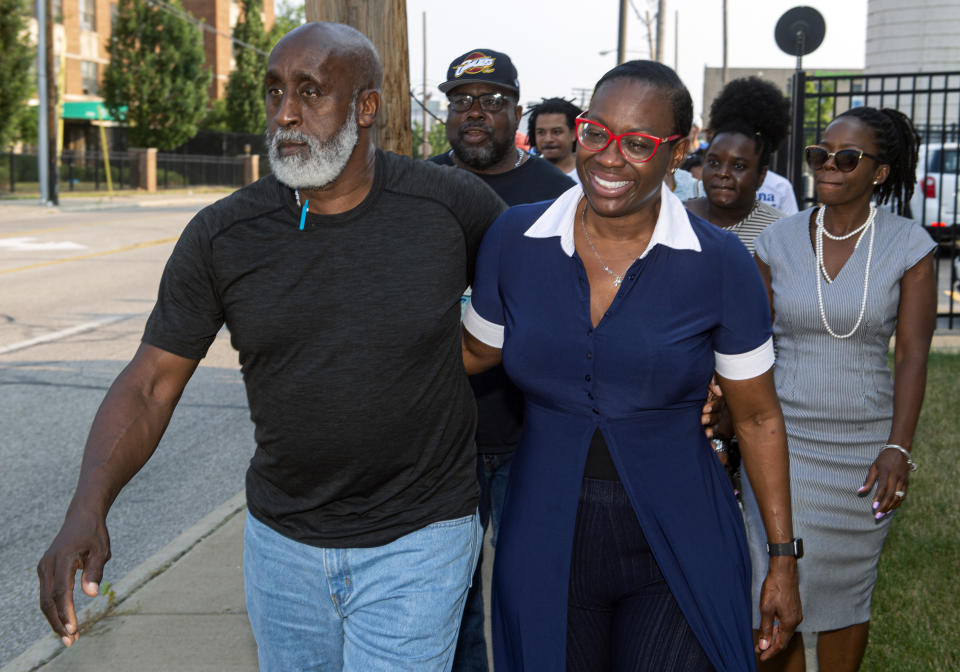 In this July 7, 2021, photo Nina Turner, right, a candidate running in a special Democratic primary election for Ohio's 11th Congressional District walks with her father, Tallib Ilaahee to the Cuyahoga County Board of Elections before casting their votes in Cleveland. (AP Photo/Phil Long)