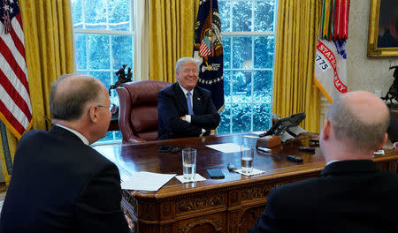 U.S. President Donald Trump smiles during an interview with Reuters at the White House in Washington, U.S., January 17, 2018. REUTERS/Kevin Lamarque