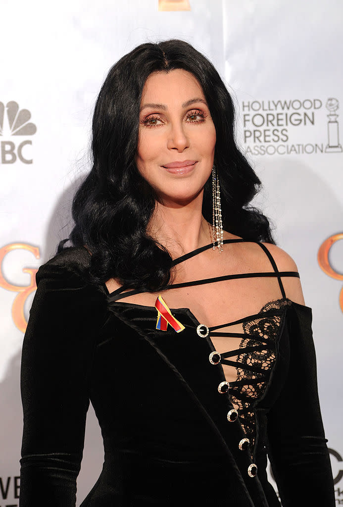 Cher is famous for her signature black locks, pictured in 2010. (Getty Images)