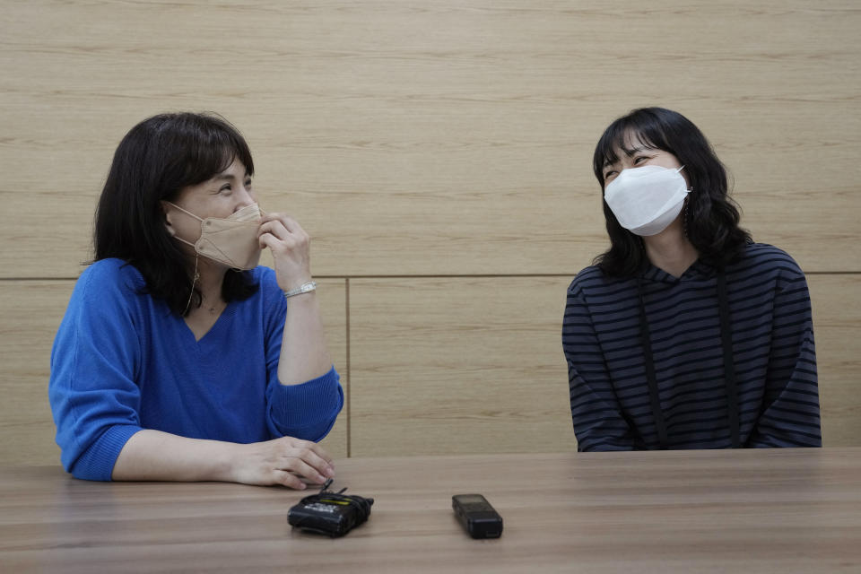 Park Seong Hee, left, a 50-year-old South Korean instructor in a craft class, and Song Hyo Eun, a 39-year-old South Korean, smile during an interview at the Inter-Korean Cultural Integration Center in Seoul, South Korea, on June 10, 2021. The center, which opened last year, is South Korea’s first government-run facility to bring together North Korean defectors and local residents to get to know each other through cultural activities and fun. It’s meant to support defectors’ often difficult resettlement in the South, but also aims at studying the possible blending of the rivals’ cultures should they unify. (AP Photo/Ahn Young-joon)