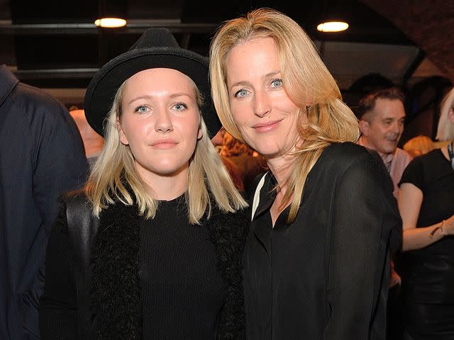 <p>David M. Benett/Dave Benett / Getty</p> Piper Klotz and Gillian Anderson attend the Global Triumph Bonneville launch on October 28, 2015 in London, England.