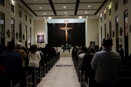 People attend a mass at a local church after a teenage student shot several students and a teacher at the private school Colegio Americano del Noreste before killing himself, in Monterrey, Mexico, January 18, 2017. REUTERS/Daniel Becerril