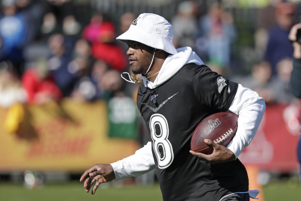 Baltimore Ravens quarterback Lamar Jackson runs with the ball during a practice for NFL Pro Bowl football game Wednesday, Jan. 22, 2020, in Kissimmee, Fla. (AP Photo/John Raoux)