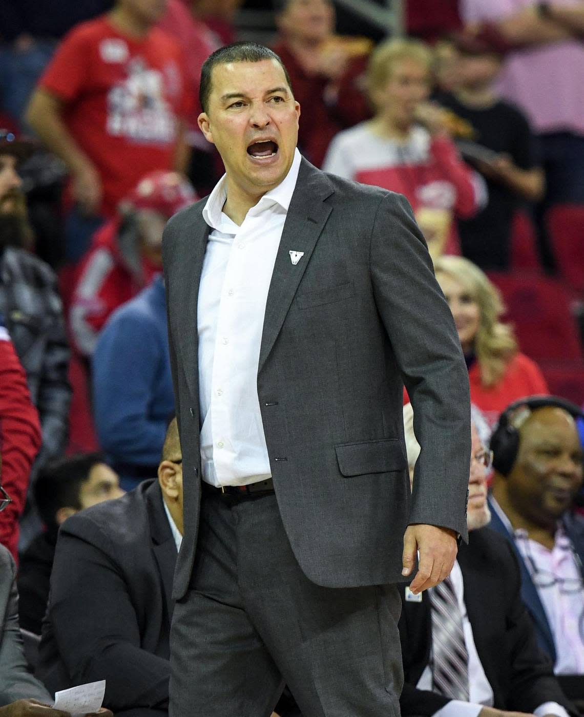 Fresno State head men’s basketball coach Justin Hutson yells from the bench during the Bulldogs’ game with Utah State at the Save Mart Center in Fresno on Saturday, Jan. 28, 2023.