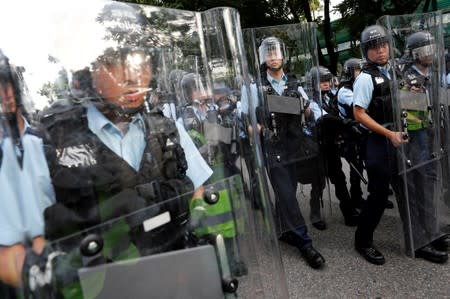 Riot police stand guard during a march at Sheung Shui, a border town in Hong Kong