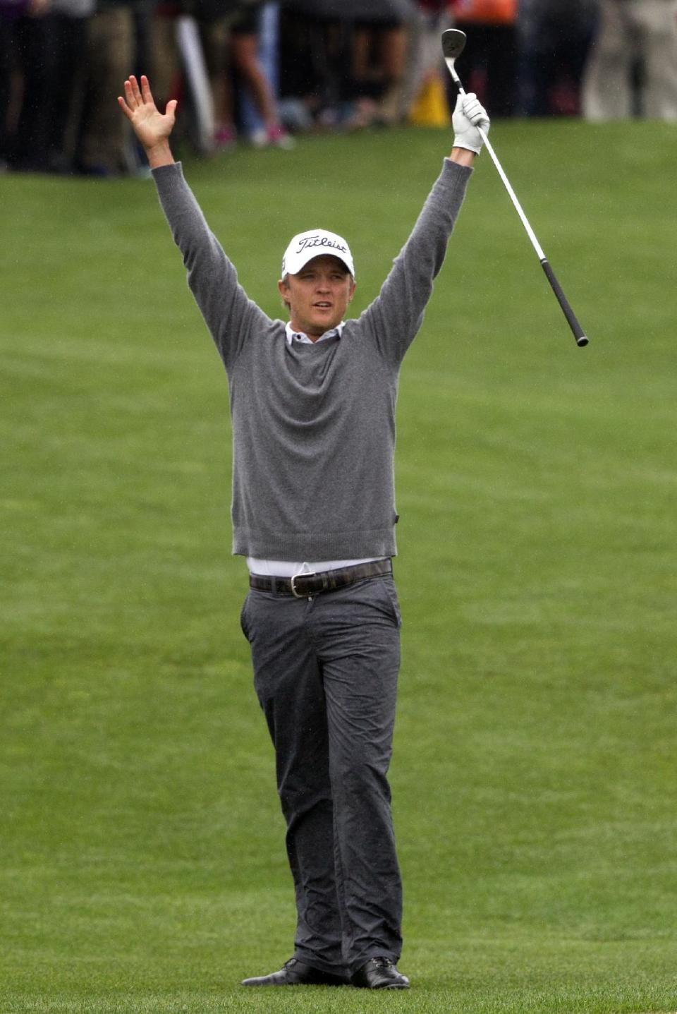 Matt Jones celebrates after chipping in for birdie on a playoff hole against Matt Kuchar to win the Houston Open golf tournament on Sunday, April 6, 2014, in Humble, Texas. (AP Photo/Patric Schneider)
