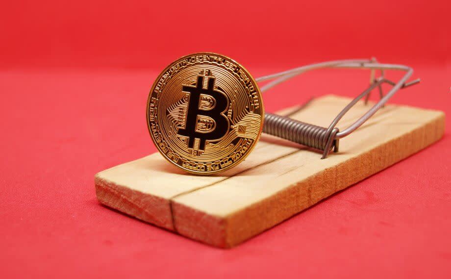 Bitcoin münze als Käder in einer Mausefalle