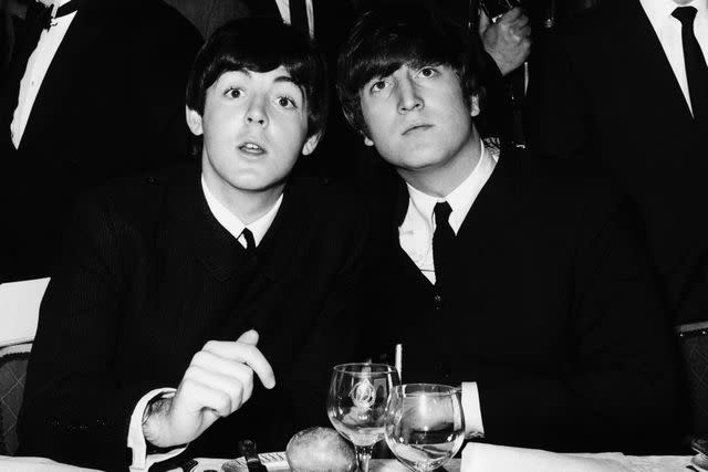 <p>William Vanderson/Fox Photos/Getty</p> Paul McCartney and John Lennon at the Variety Club Showbusiness Awards in London in 1964