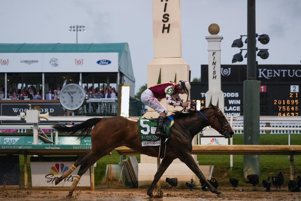 Brian Hernandez Jr. rides Thorpedo Anna (5) to win the 150th running of the Kentucky Oaks horse race Churchill Downs Friday, May 3, 2024, in Louisville, Ky. (AP Photo/Kiichiro Sato)