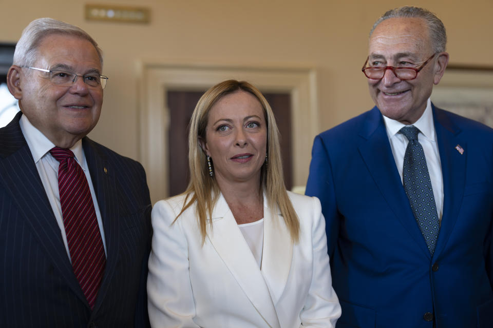 Italian Prime Minister Giorgia Meloni, center, is welcomed by Senate Foreign Relations Committee Chair Bob Menendez, D-N.J., and Senate Majority Leader Chuck Schumer, D-N.Y., right, before a luncheon meeting at the Capitol in Washington, Thursday, July 27, 2023. (AP Photo/J. Scott Applewhite)