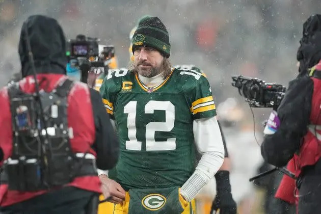 A dejected Aaron Rodgers walks off the field after the Packers lost to the 49ers in a playoff game on Saturday. (Photo: Patrick McDermott via Getty Images)