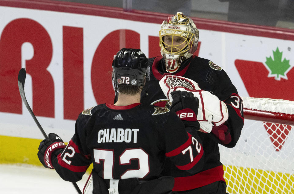 Ottawa Senators defenseman Thomas Chabot congratulates goaltender Anton Forsberg after defeating the Dallas Stars in an NHL hockey game, Thursday, Feb. 22, 2024 in Ottawa, Ontario. (Adrian Wyld/The Canadian Press via AP)