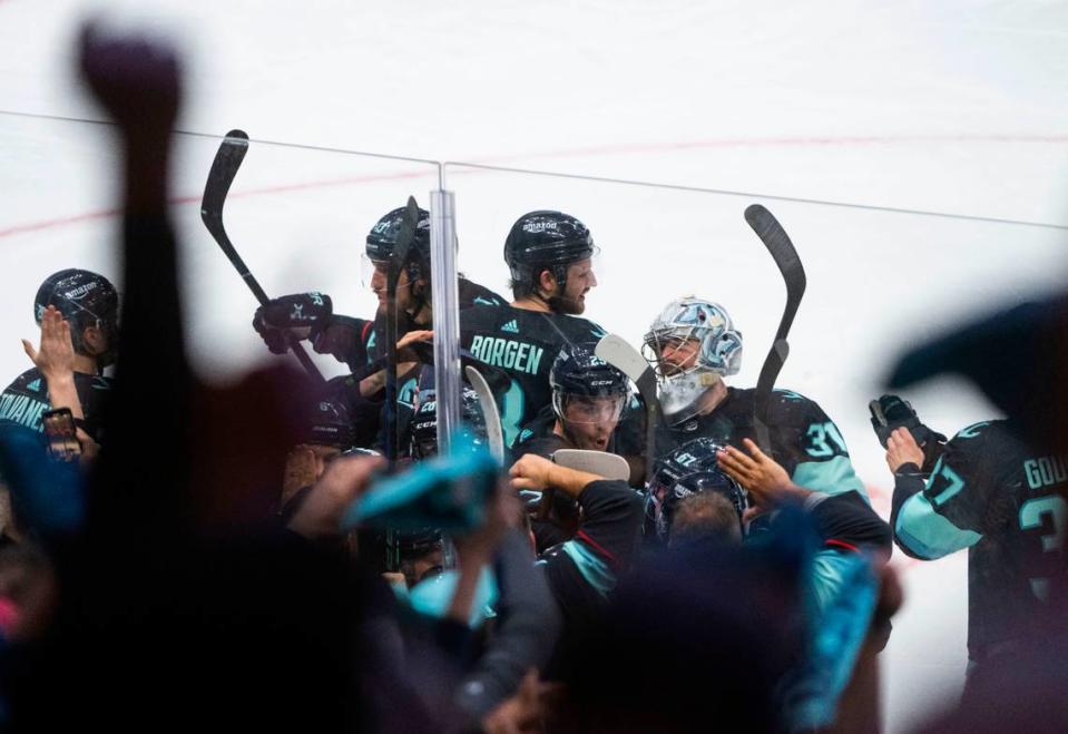 Seattle Kraken players celebrate after winning a first round 2023 Stanley Cup Playoffs game against the Colorado Avalanches in overtime at Climate Pledge Arena in Seattle on Monday, April 24, 2023. The Kraken won 3-2. The Kraken won 3-2. Cheyenne Boone/Cheyenne Boone/The News Tribune