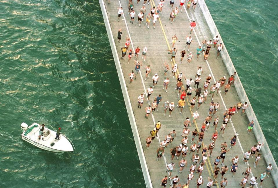 Boaters watch runners participating in the 20th Annual Seven Mile Bridge Run Saturday, April 21, 2001, race across the longest of 42 bridges that help comprise the Florida Keys’ Overseas Highway. The event, which attracted 1,500 participants, began in 1982 to help herald the completion of a then-new Seven Mile Bridge. The race across the convergenece of the Atlantic Ocean and Gulf of Mexico is regarded by several running magazines as one of the top running events in America.
