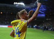 BATE's Jasse Tuominen, foreground, celebrates after scoring the opening goal during the Champions League play-off round, 1st leg soccer match between Bate and PSV at the Borisov-Arena stadium in Borisov, Belarus, Tuesday, Aug. 21, 2018. (AP Photo/Sergei Grits)