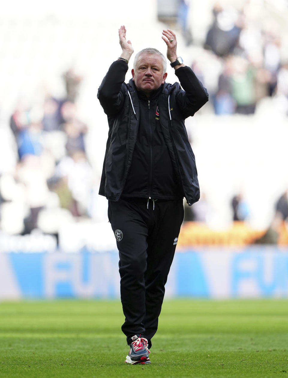 Sheffield United's head coach Chris Wilder applauds the fans after the English Premier League soccer match between Newcastle United and Sheffield United at St. James' Park, Newcastle, England, Saturday, April 27, 2024. (Owen Humphreys/PA via AP)