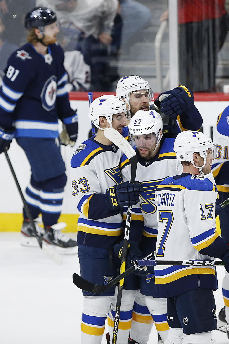 St. Louis Blues' David Perron (57) celebrates the winning goal in overtime against the Winnipeg Jets in NHL hockey game action in Winnipeg, Manitoba, Friday, Dec. 27, 2019. (John Woods/The Canadian Press via AP)